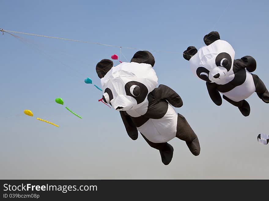 Colorful kites on blue sky