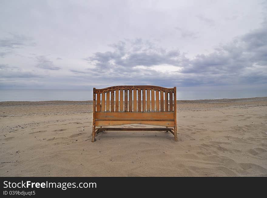 A bench looking out across the sea and sky. A bench looking out across the sea and sky