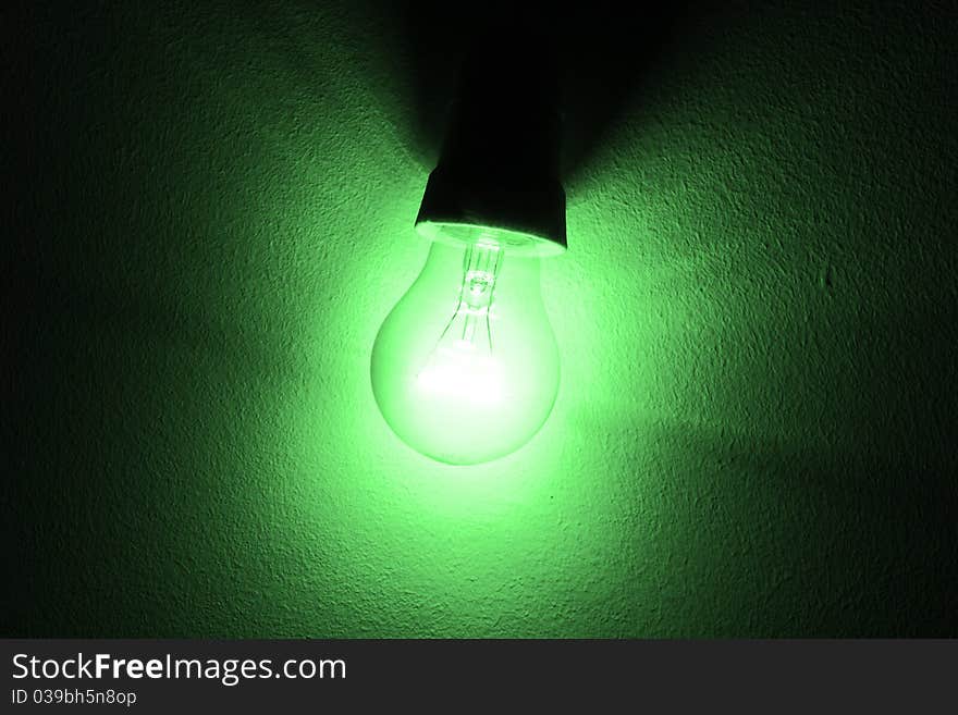 Concept of lighten light bulb. Green photo filter. Concept of lighten light bulb. Green photo filter