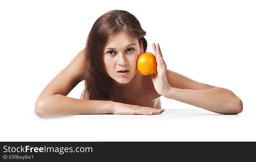 The Adult Woman With An Orange Fruit