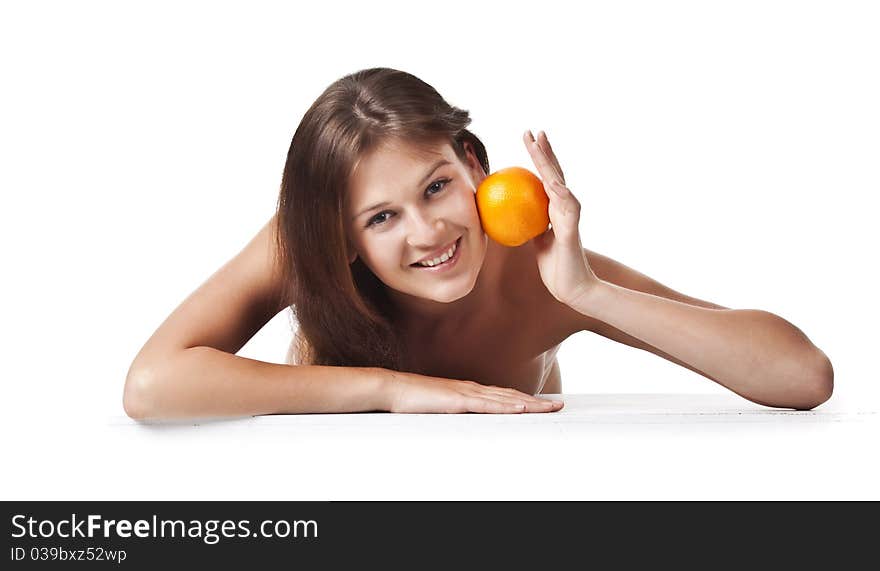 The Adult Woman With An Orange Fruit