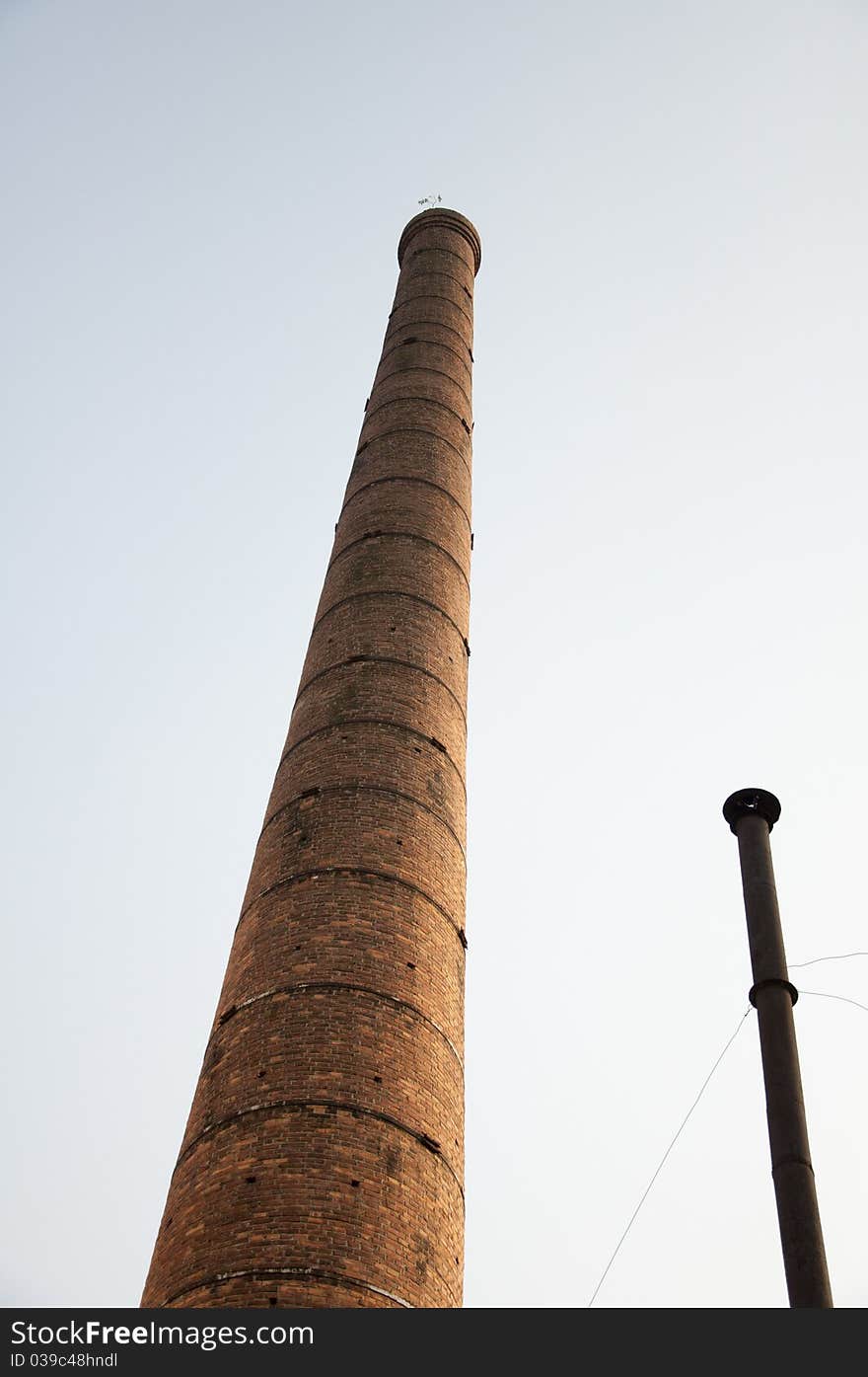 Brick chimney and metal chimney,architecture