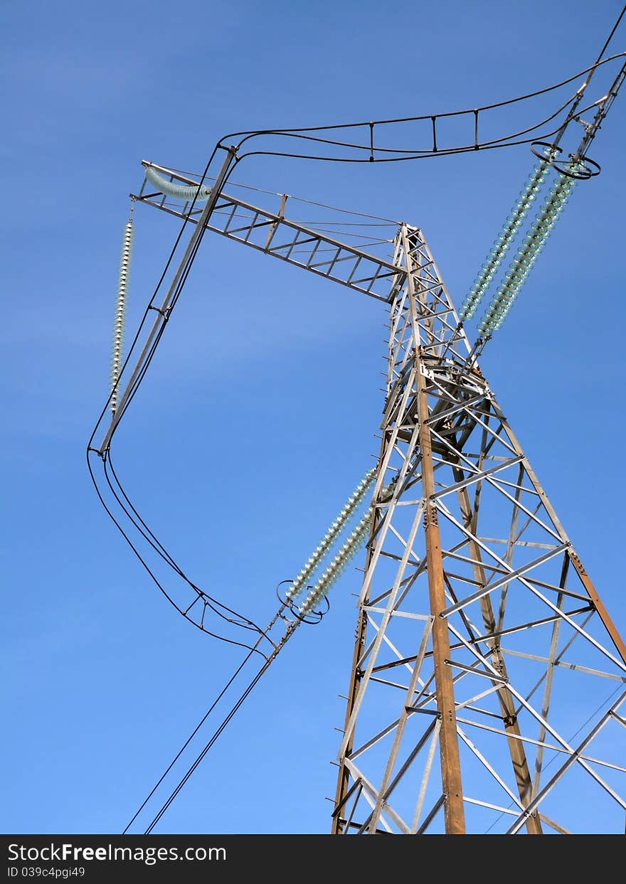 Power lines against the clear blue sky