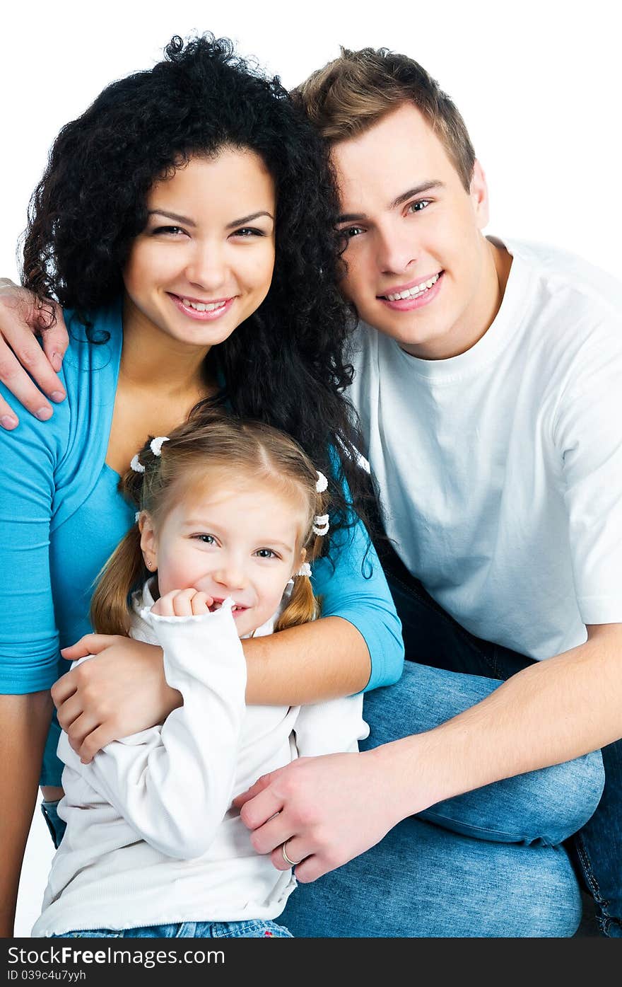 Happy family with a baby on a white background