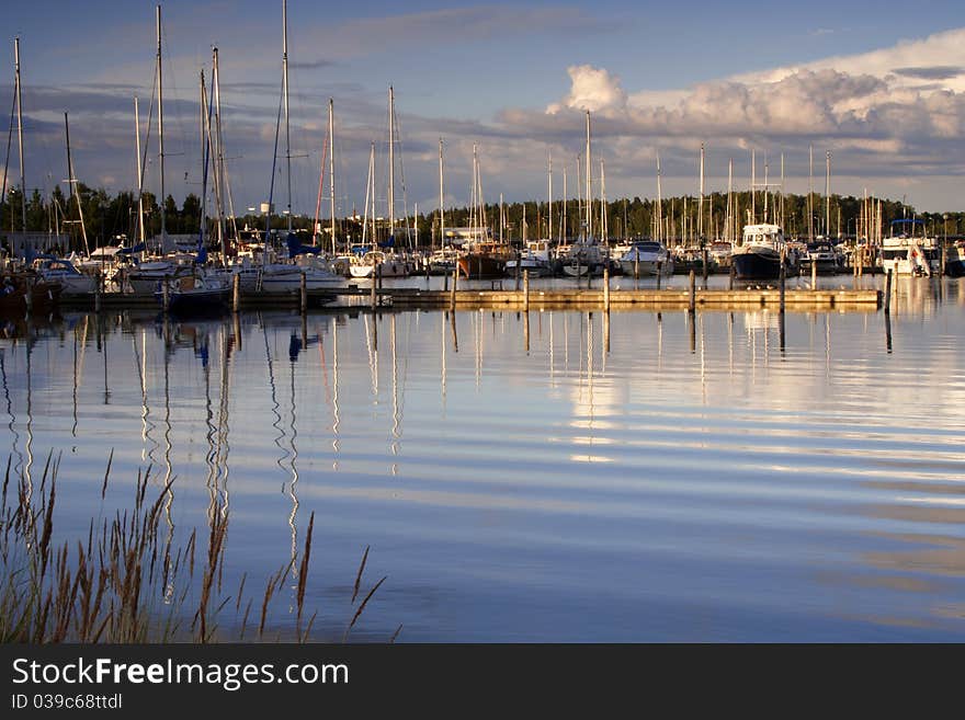 Boat harbor in summer evening