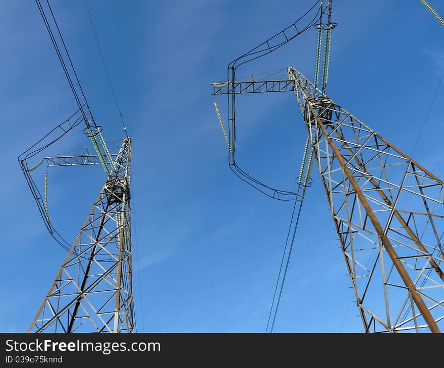 Power lines against the clear blue sky