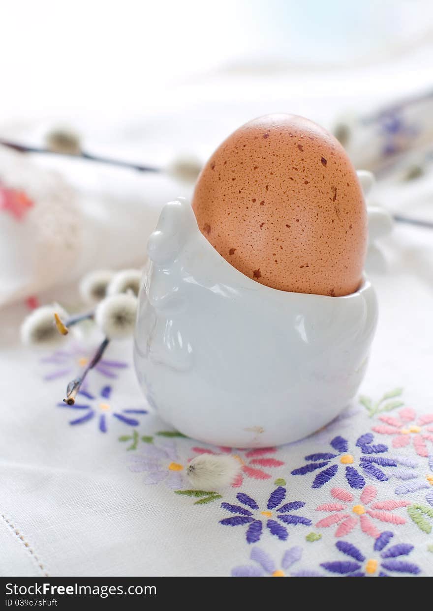 Easter Egg with a willow branch in eggcup