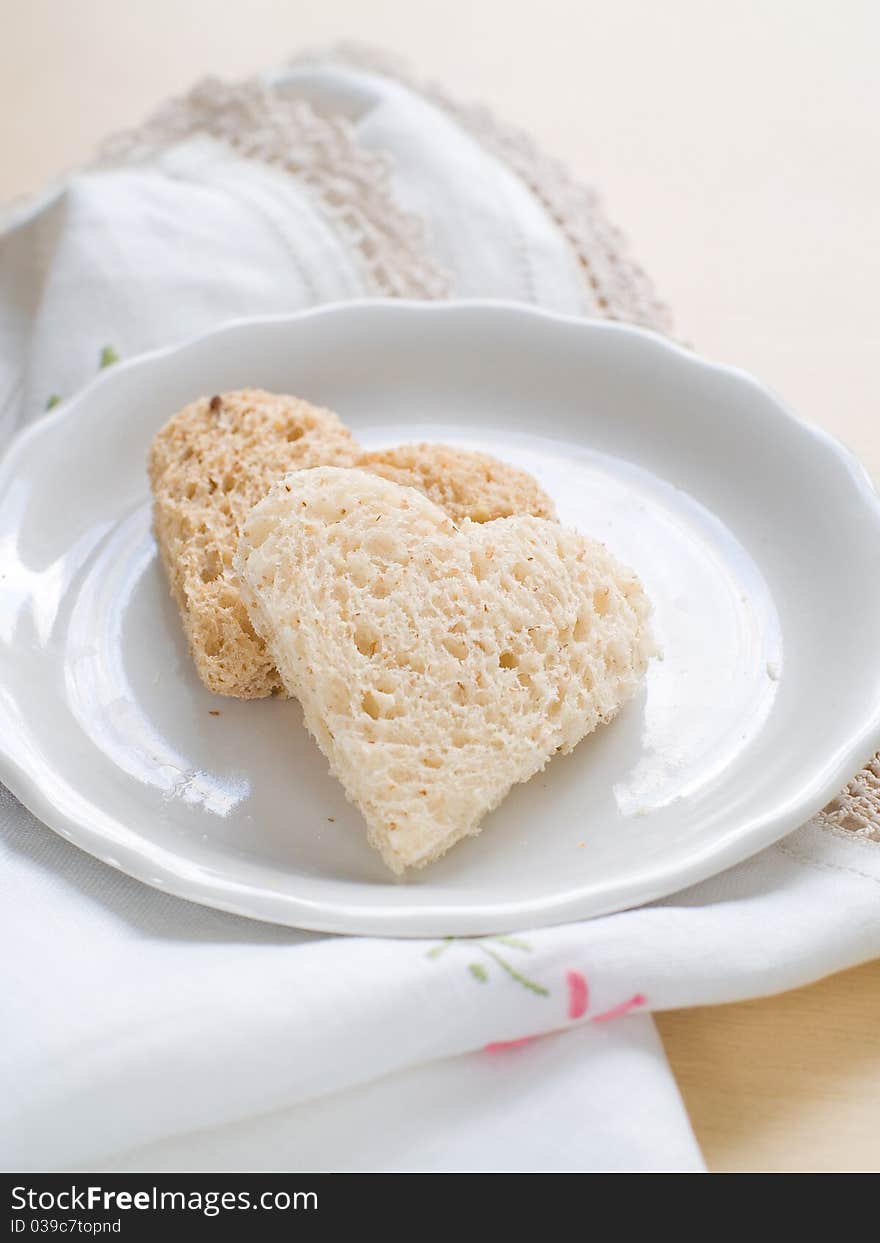 Heart shaped homemade brown bread with cereals