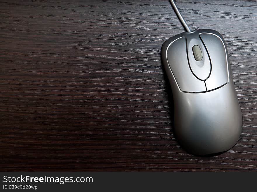 Single silver pc mouse on table. Studio shot. Single silver pc mouse on table. Studio shot