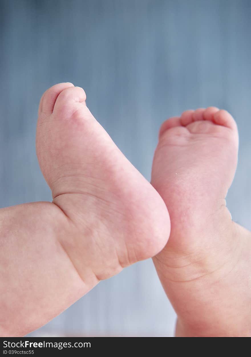 Baby feet. Four months old baby girl. Clipping path included.