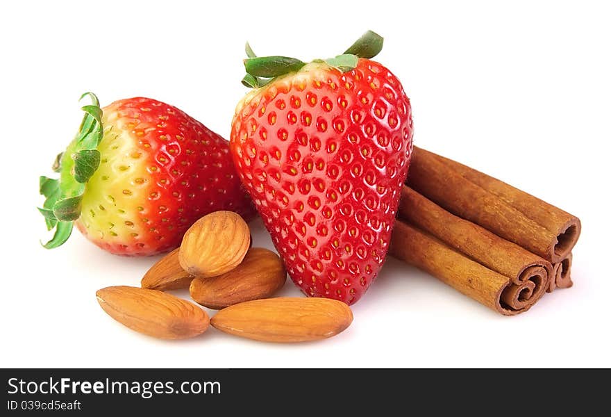 Strawberry with almonds and cinnamon on a white background