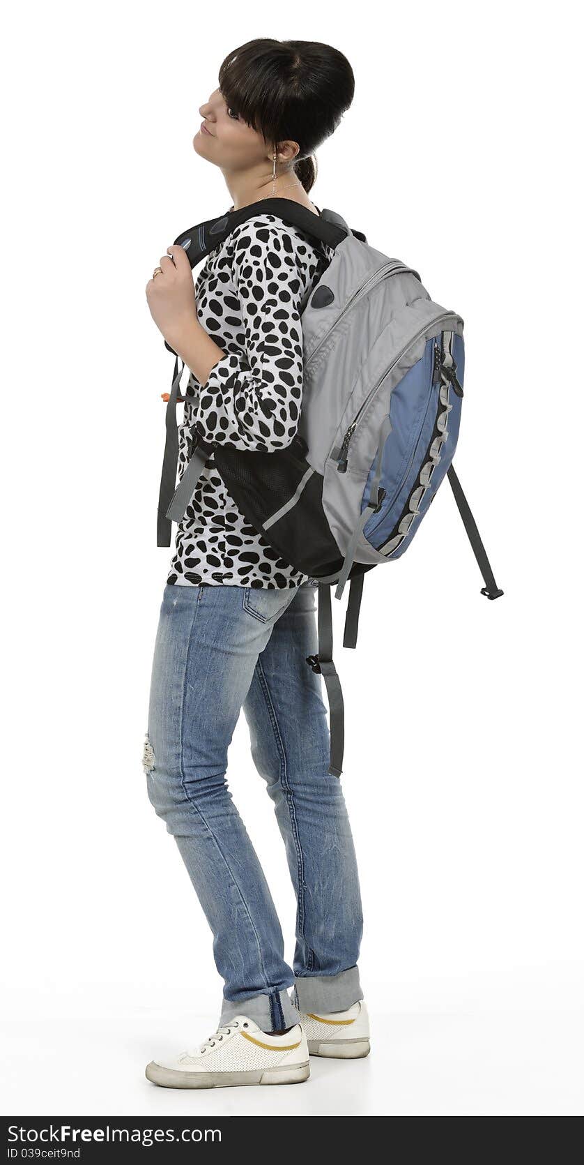 Young student with his backpack, the picture is done in studio, isolated on white. Young student with his backpack, the picture is done in studio, isolated on white