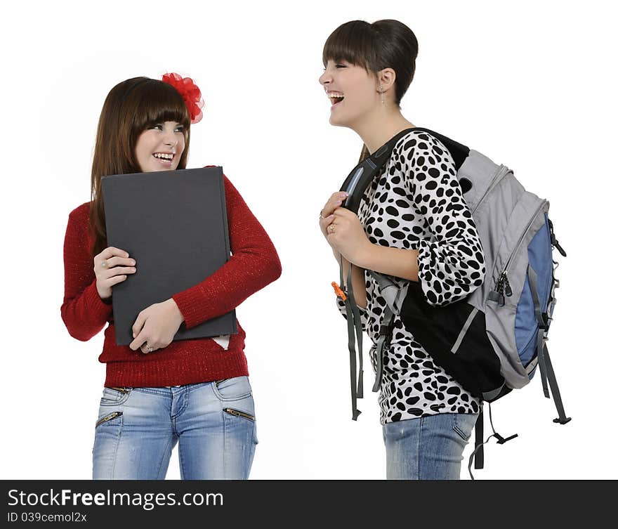 Two friends with a backpack and a book posing. Two friends with a backpack and a book posing