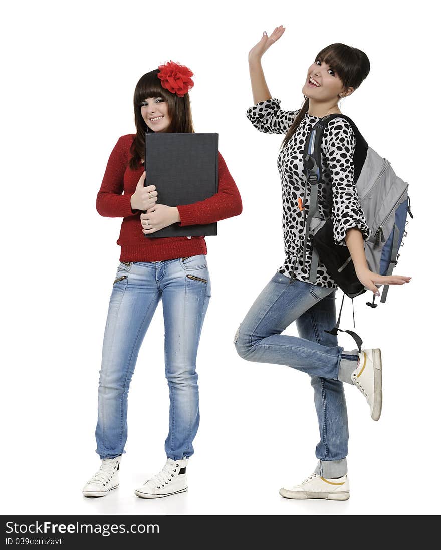 Two friends with a backpack and a book posing. Two friends with a backpack and a book posing