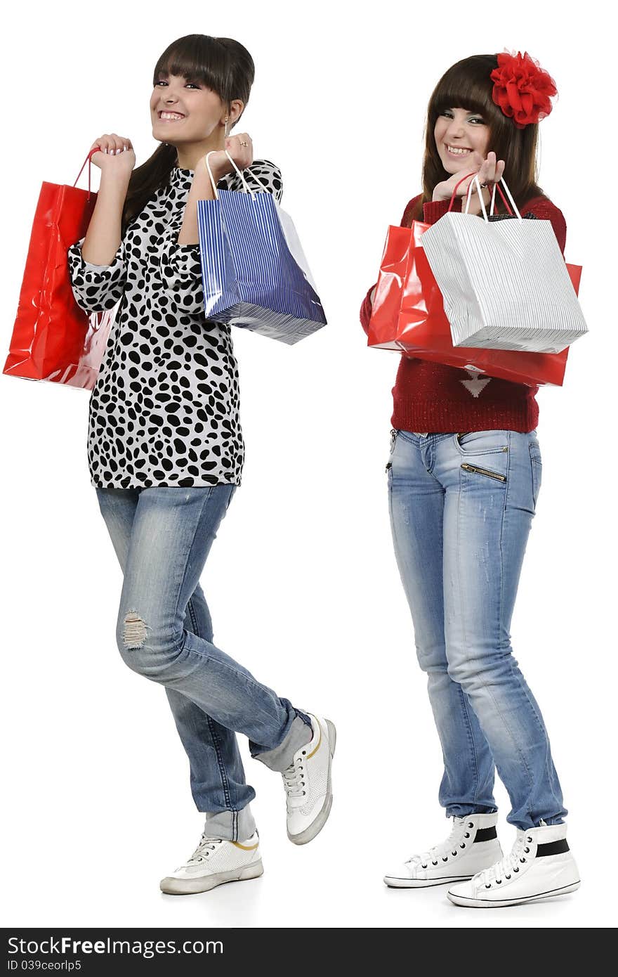 Two friends shopping with gift bags in hand. Two friends shopping with gift bags in hand