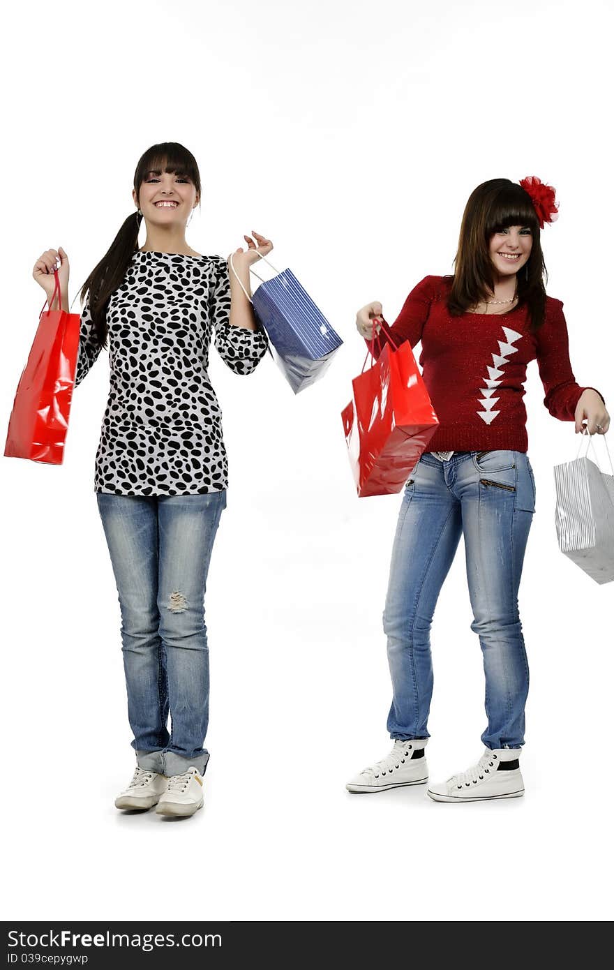 Two friends shopping with gift bags in hand. Two friends shopping with gift bags in hand