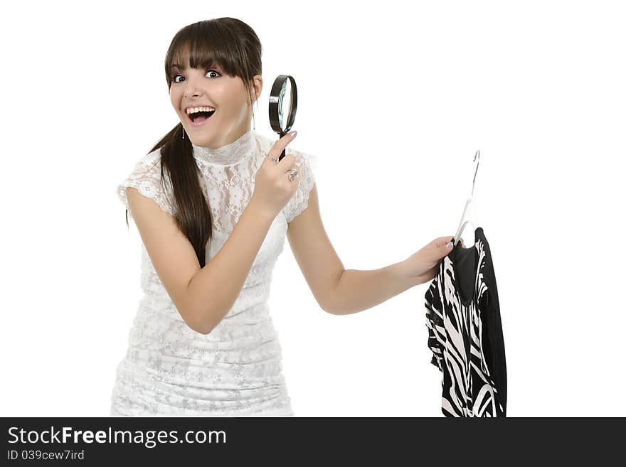 Young woman is holding a hanger with a T-shirt. Young woman is holding a hanger with a T-shirt