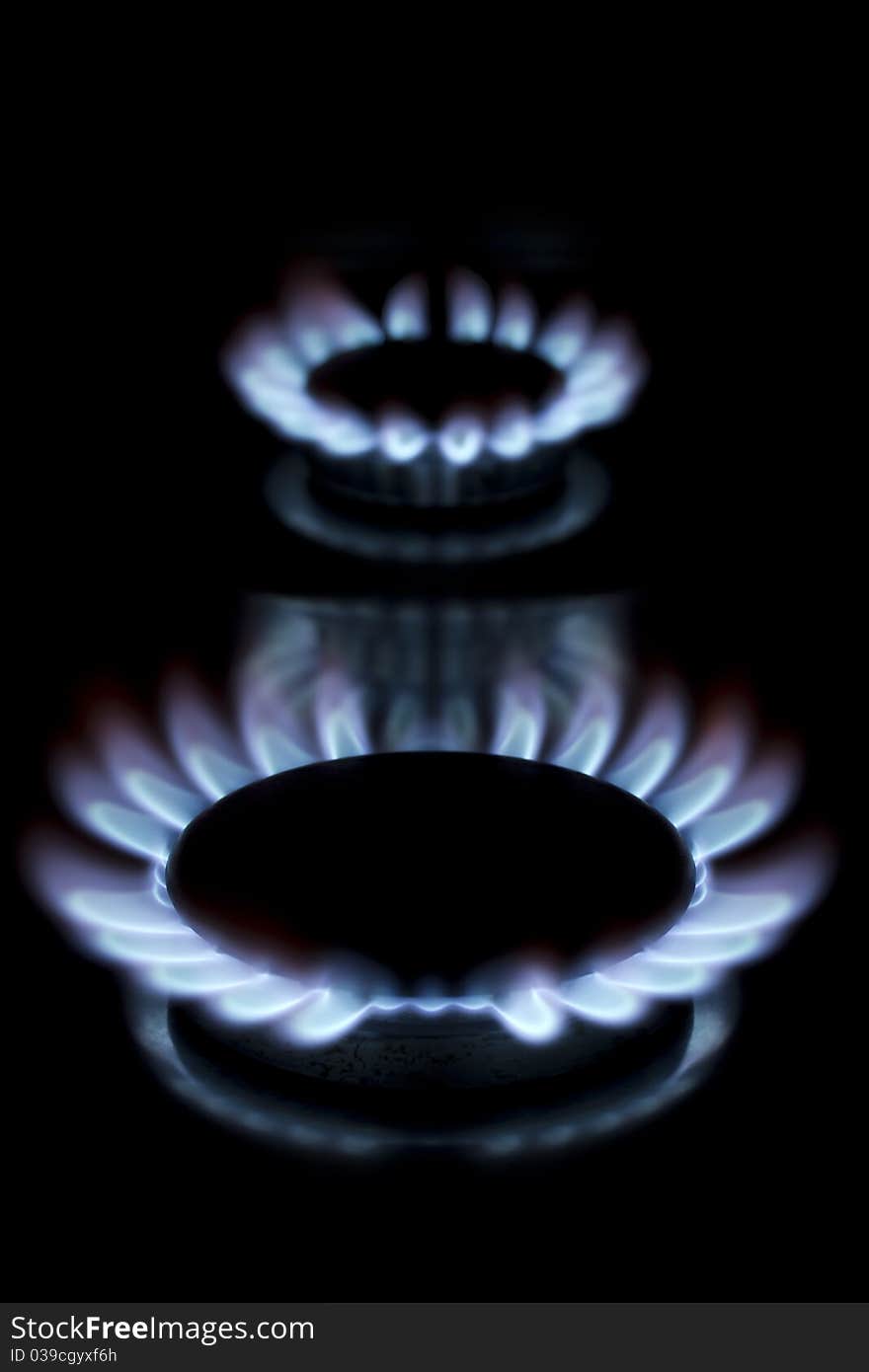 Two lit gas rings