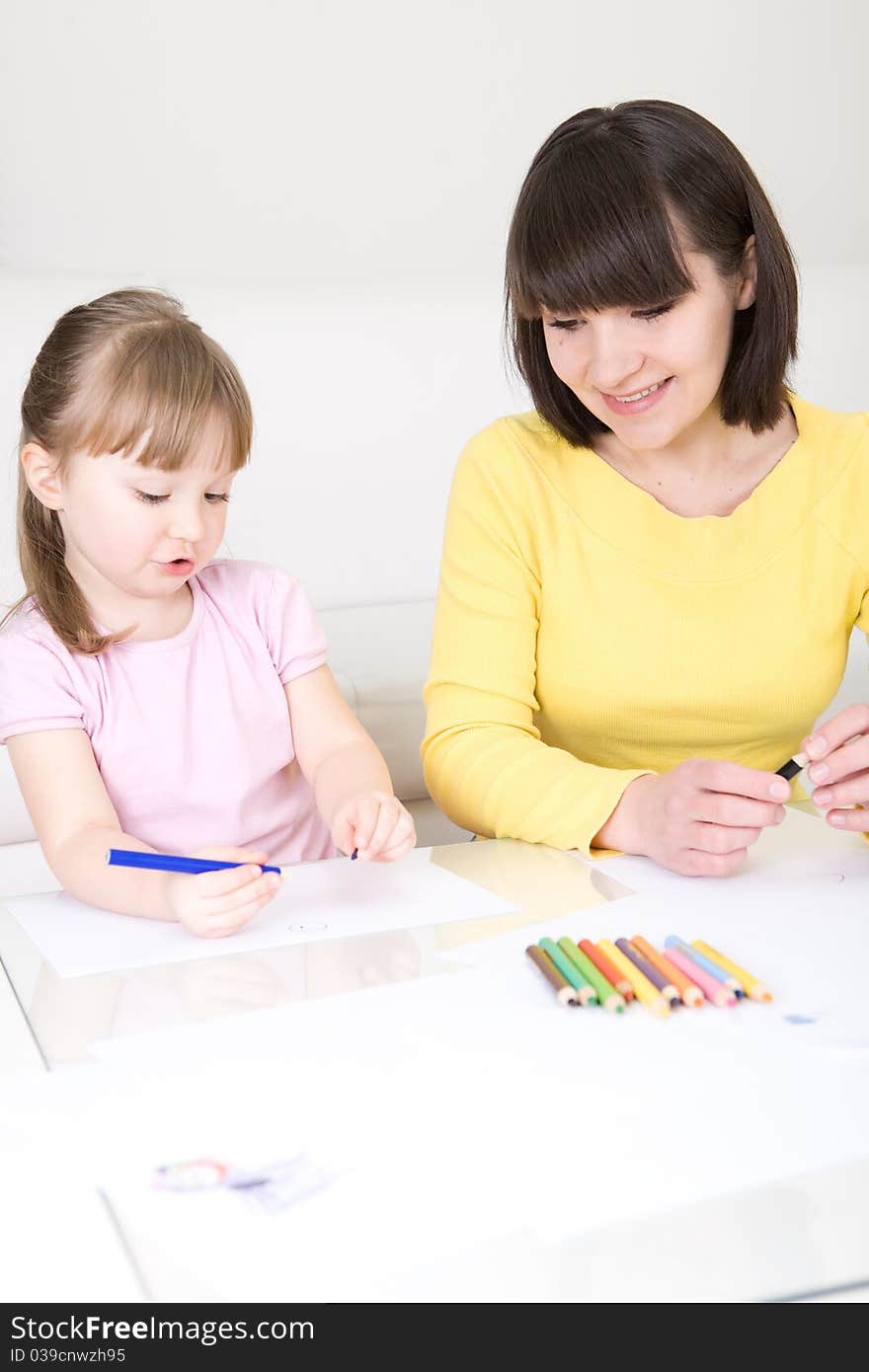 Mother and daughter having fun in kindergarden