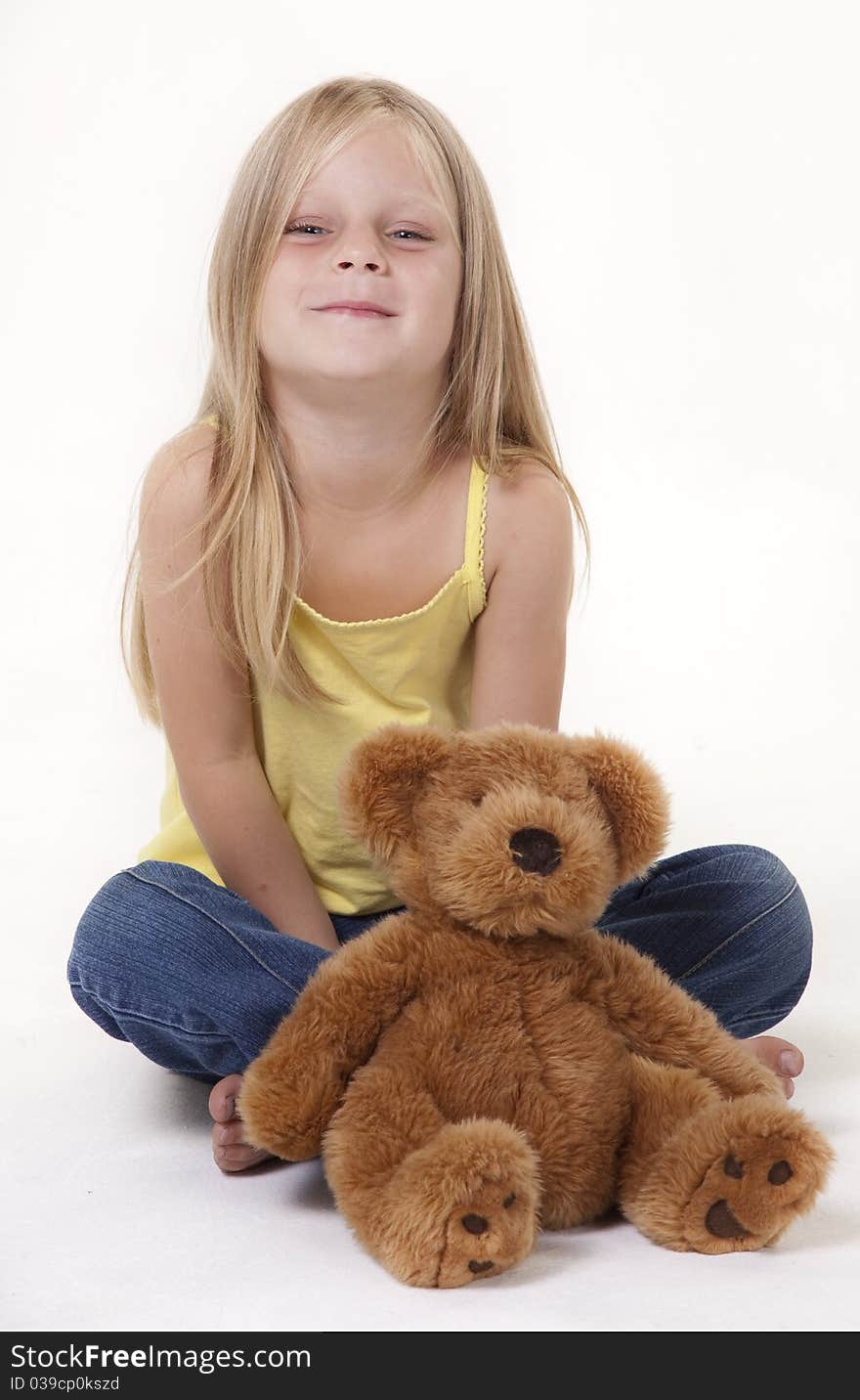 Little girl with a pleased expression, looking at camera. Little girl with a pleased expression, looking at camera.