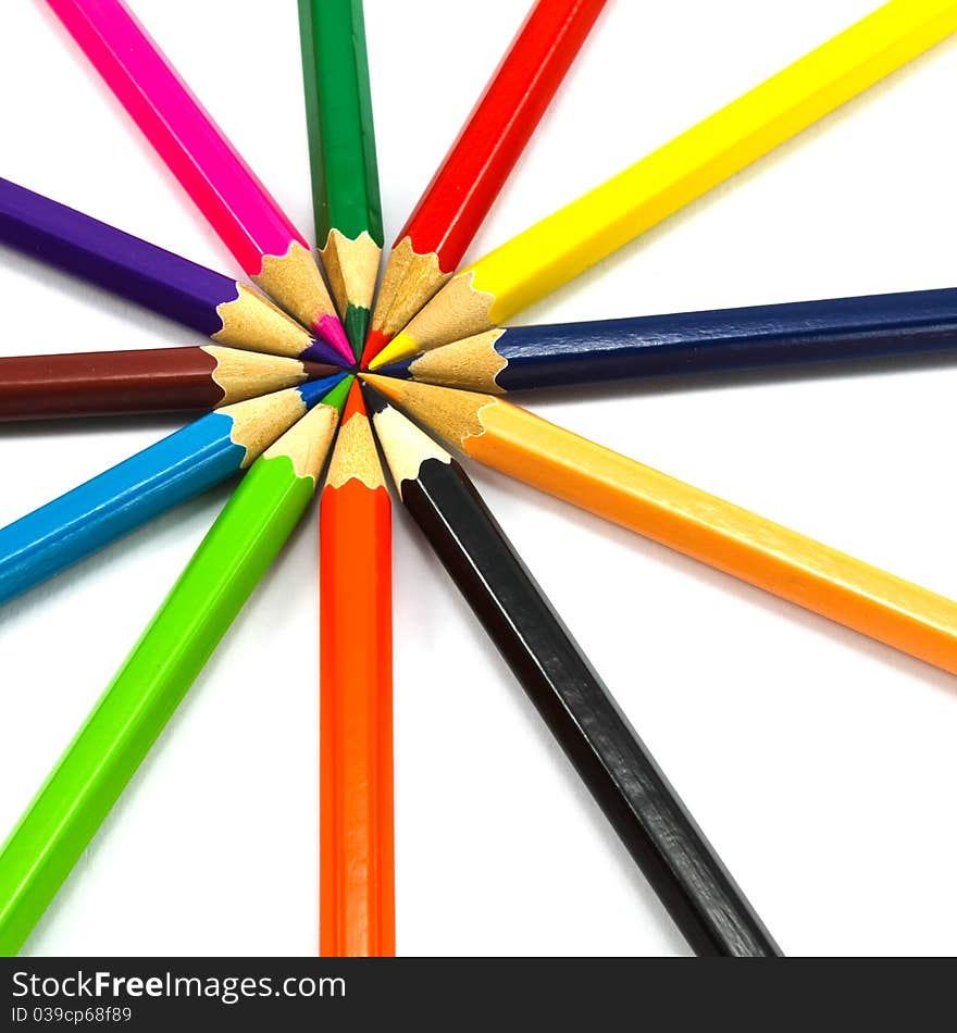 Assortment of coloured pencils on white background. Assortment of coloured pencils on white background