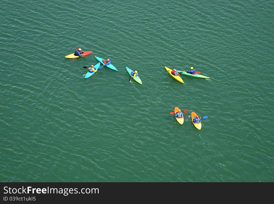 Photograph of a group of trainee canoeists struggling to control their direction of travel. Photograph of a group of trainee canoeists struggling to control their direction of travel