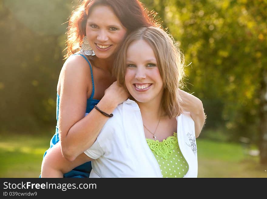 Girlfriends are having fun in the park. Girlfriends are having fun in the park