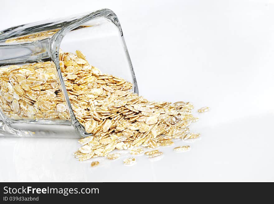 Barley flakes isolated on white background