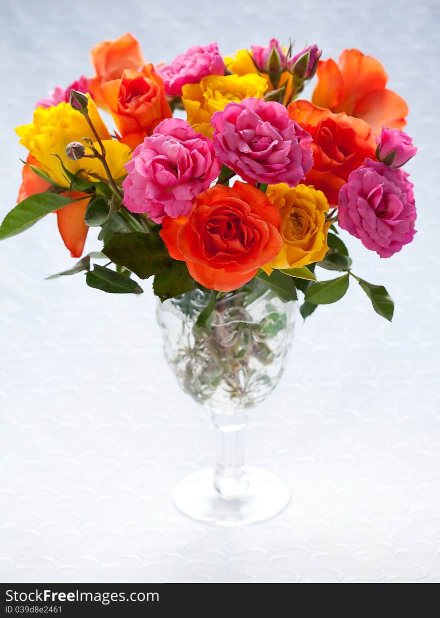 Bouquet of multi-colored roses in vase