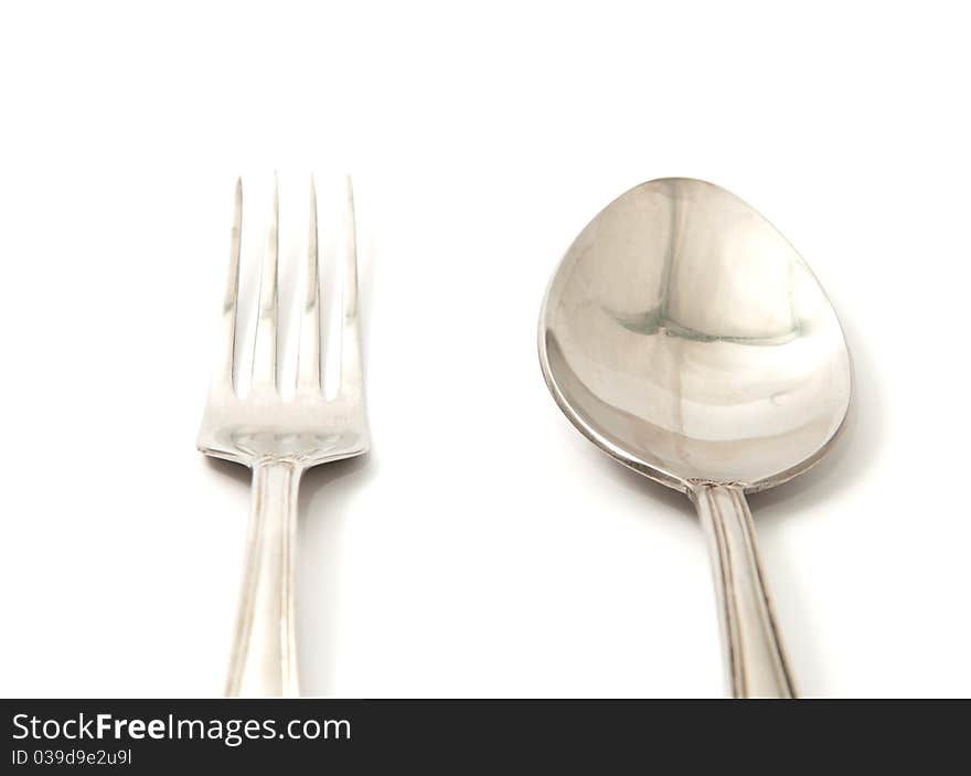 Spoon and fork on a white background