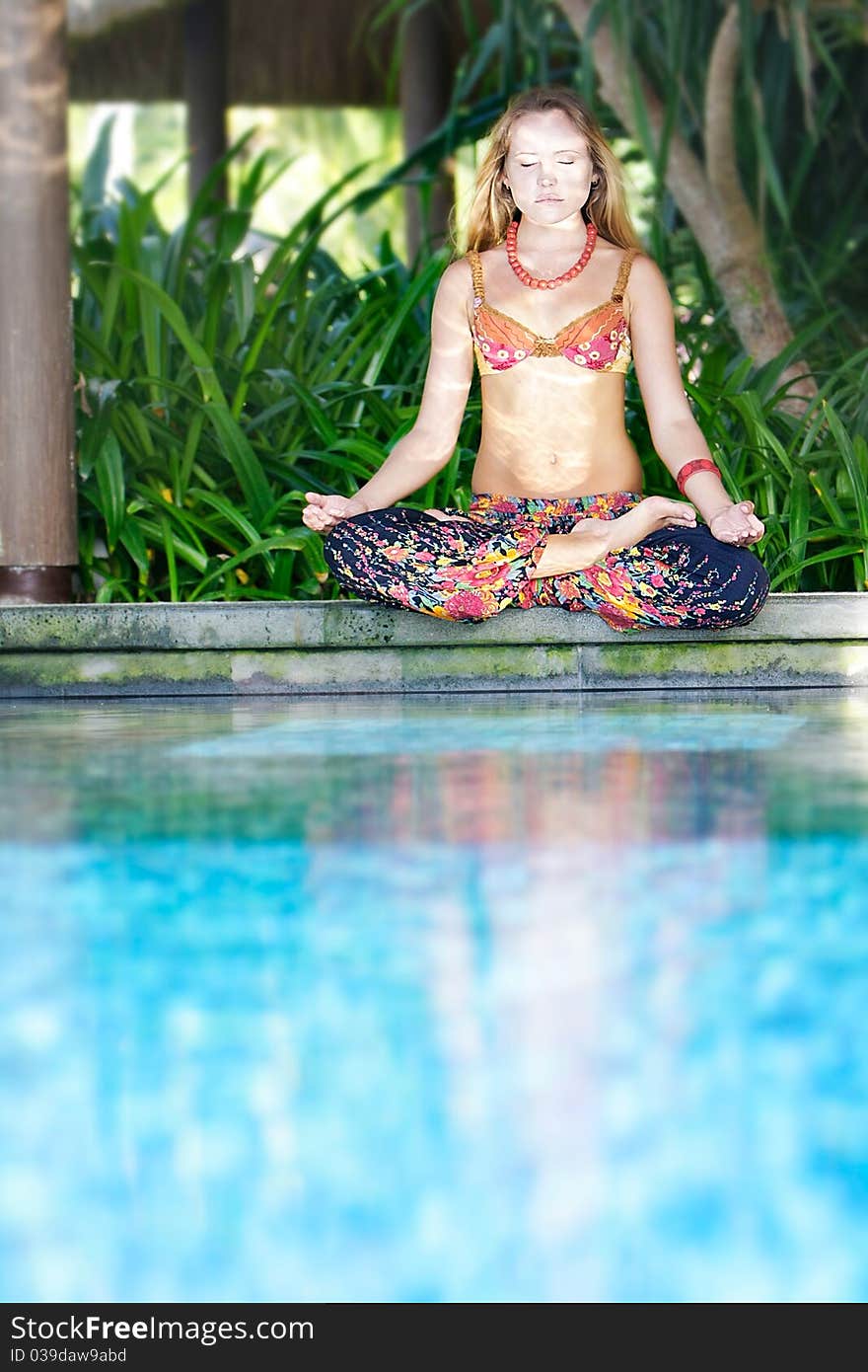 Young beautiful woman meditating on natural background. Young beautiful woman meditating on natural background