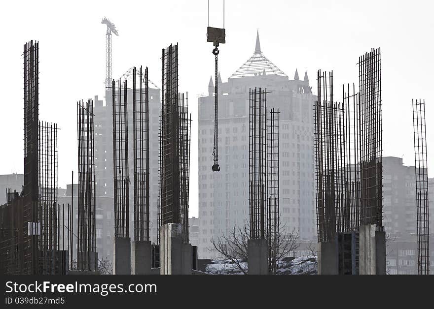 Building constructions in the city at the backgound. Building constructions in the city at the backgound