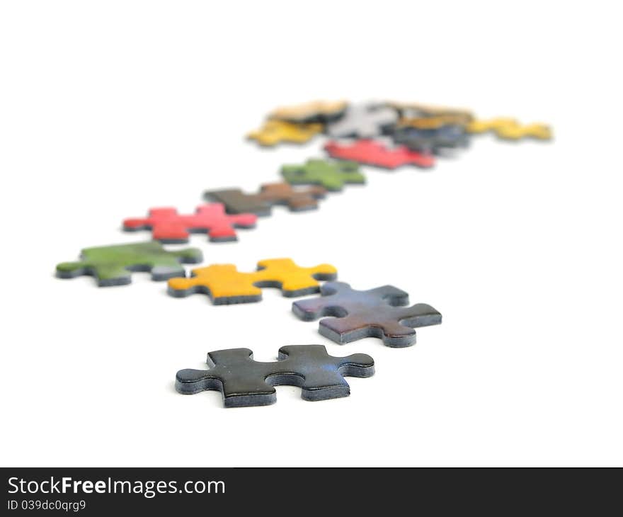 Color puzzle pieces on the white background