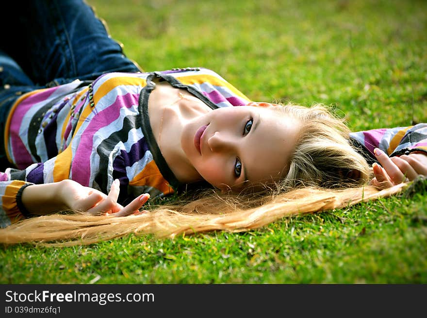 Portrait of the girl lying on a grass. Portrait of the girl lying on a grass