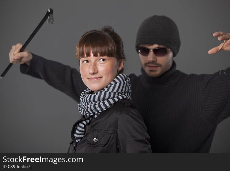 Woman do not scent a danger from thief with crowbar. Woman do not scent a danger from thief with crowbar