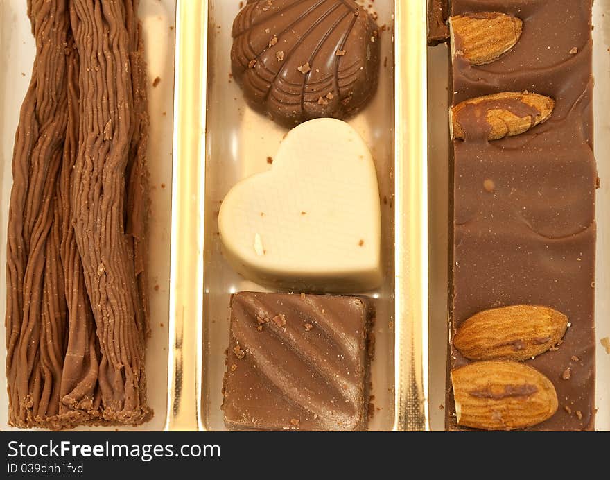 Variety of chocolates and sweets in the foreground