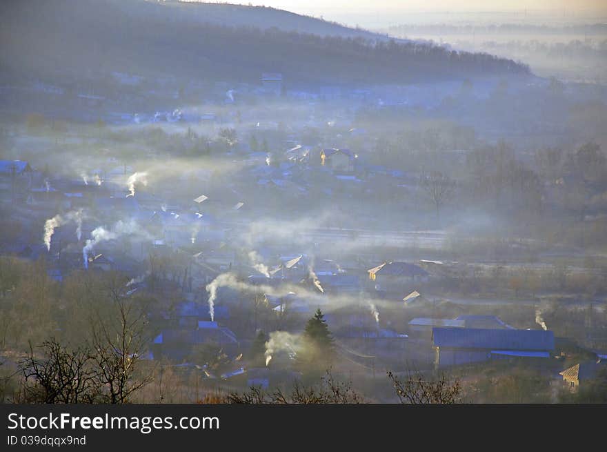 Foggy village landscape in a cold morning winter. Foggy village landscape in a cold morning winter