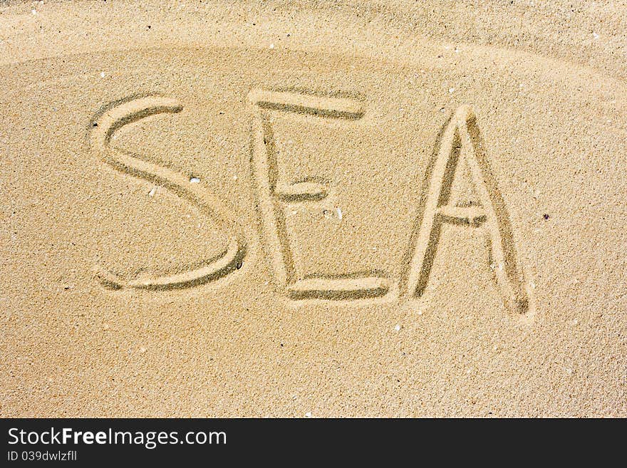 Inscription Sea on sand on a beach