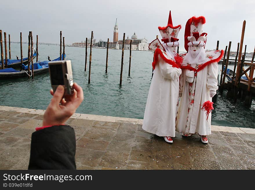 Masked revellers pose for a photo in San Marco square in Venice, Italy, on Saturday Feb. 10, 2007. The Venice Carnival runs through to Tuesday Feb. 20, 2007. Masked revellers pose for a photo in San Marco square in Venice, Italy, on Saturday Feb. 10, 2007. The Venice Carnival runs through to Tuesday Feb. 20, 2007.