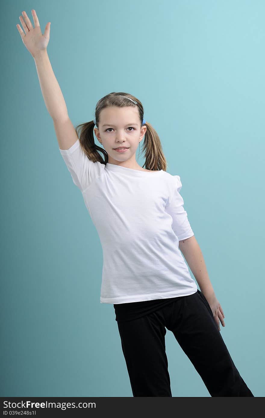 Schoolgirl exercising in studio