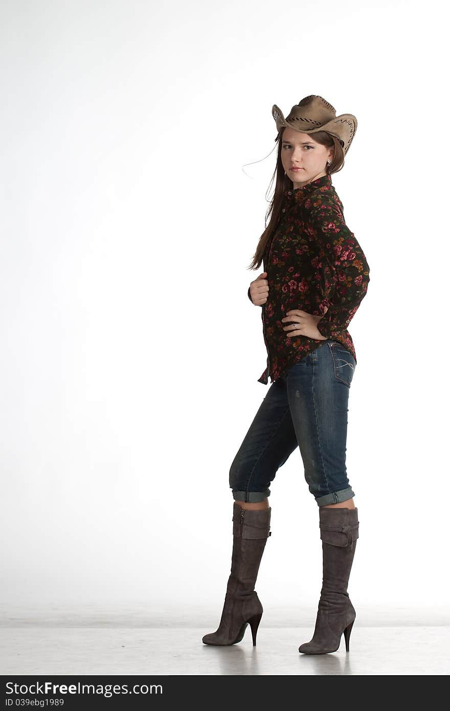 Attractive cowgirl portrait on white background