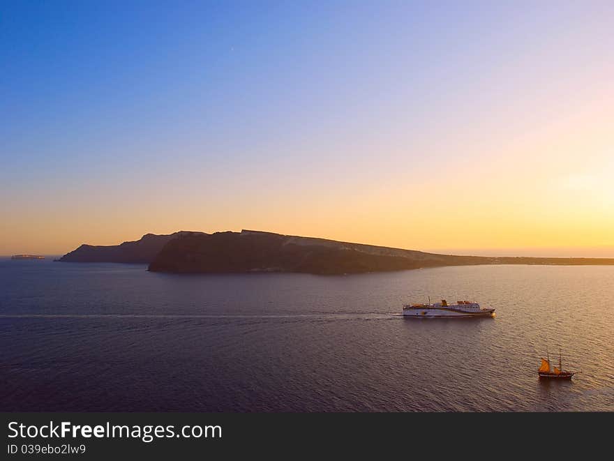 Sunset by the windmills of santorini island. Sunset by the windmills of santorini island