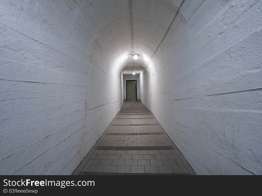 Narrow corridor in old underground hospital.