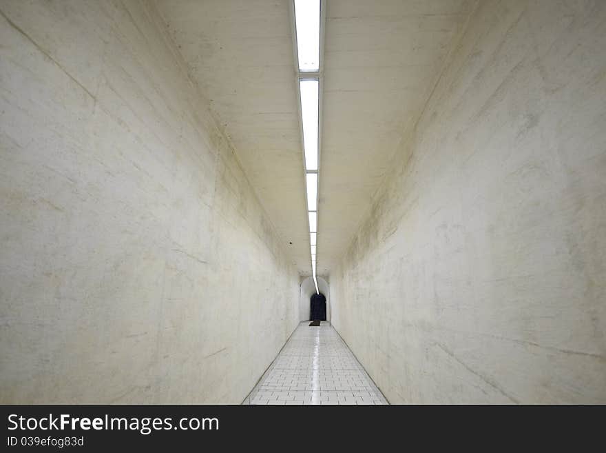 Narrow corridor in old underground hospital.