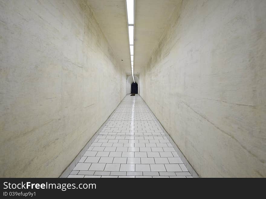 Narrow corridor in old underground hospital.