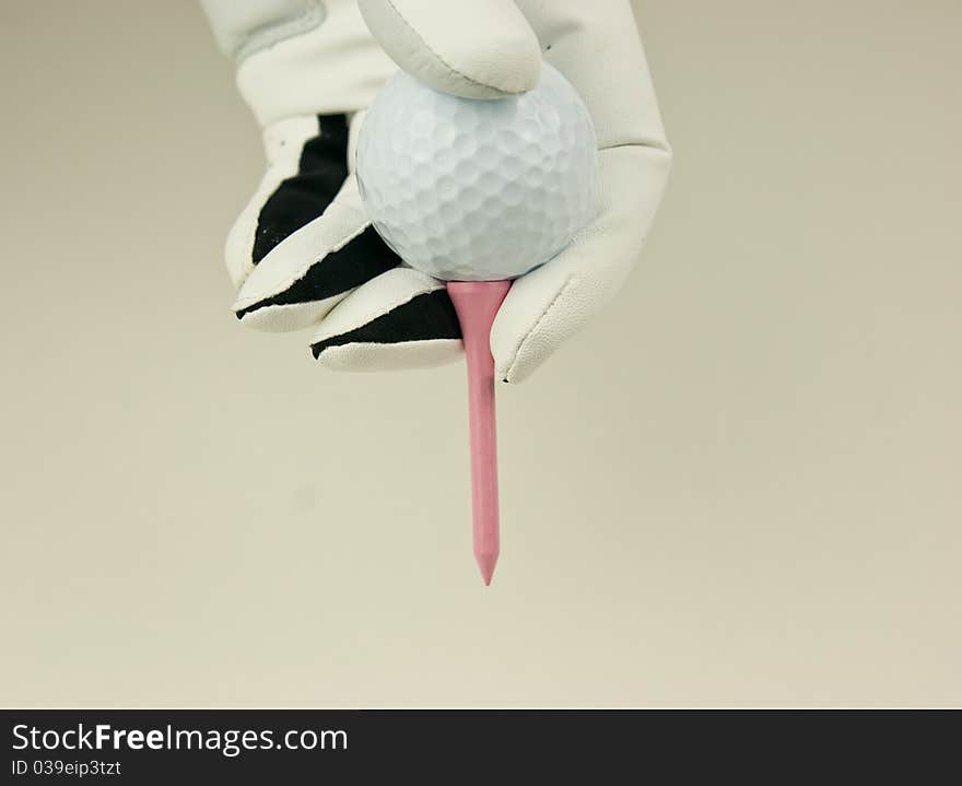 Golfglove and pink tee