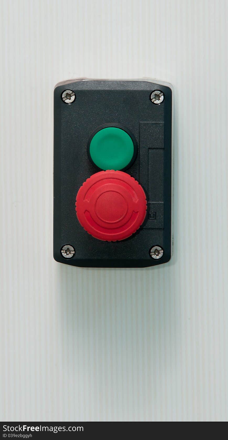 A portrait of emergency button with tile background