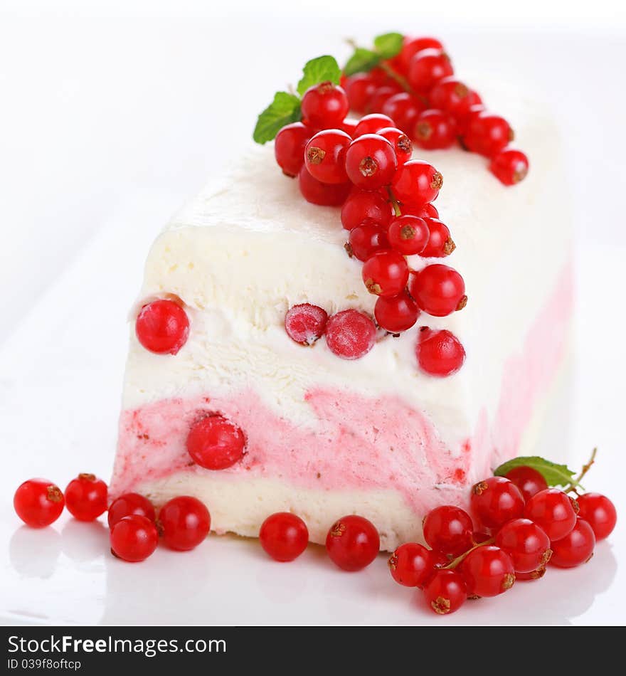 Ice cream parfait with redcurrants on white background