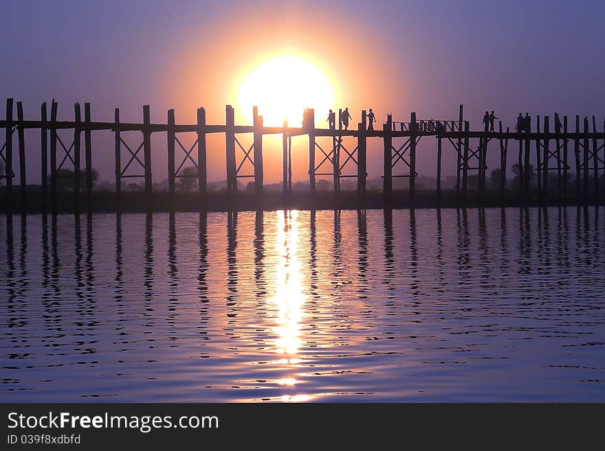 Landscape of an old wooden bridge at sunset