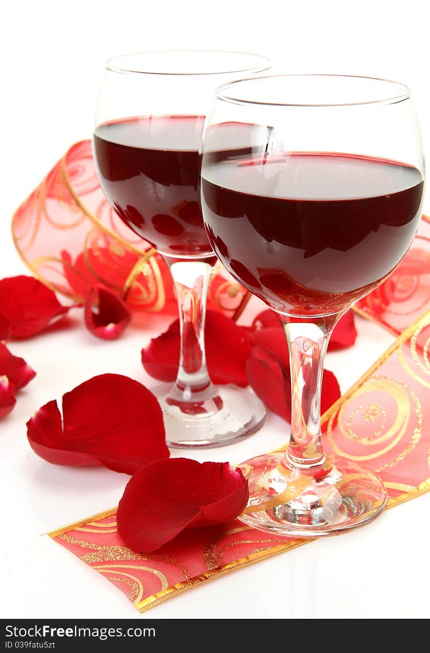 Wine and roses on a white background